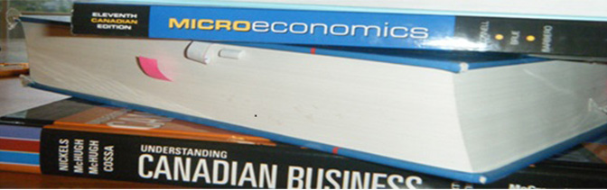 stack of economic books