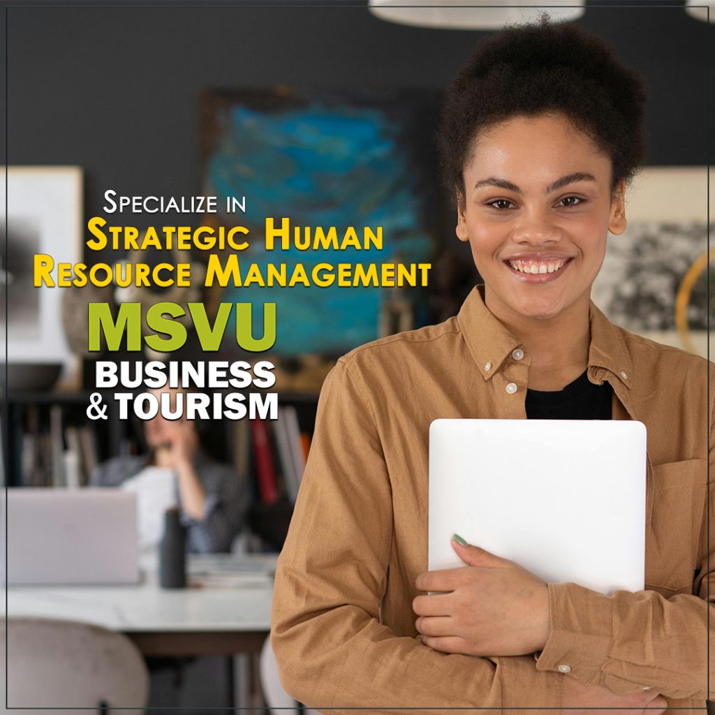 This is a photo of a smiling black woman holding a laptop wearing a brown button up shirt in the foreground with a white man in the background on the phone sitting in front of a desk in a trendy office. Centered in the photo are the words in white specialize in and under that in yellow strategic human resource management and under that the MSVU business and tourism logo.