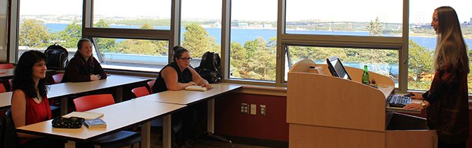 Business Students and instructor in a classroom in McCain centre