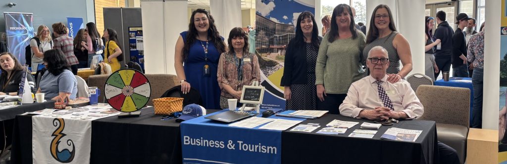 Business and Tourism instructors and staff giving information at a open campus day event May 2026