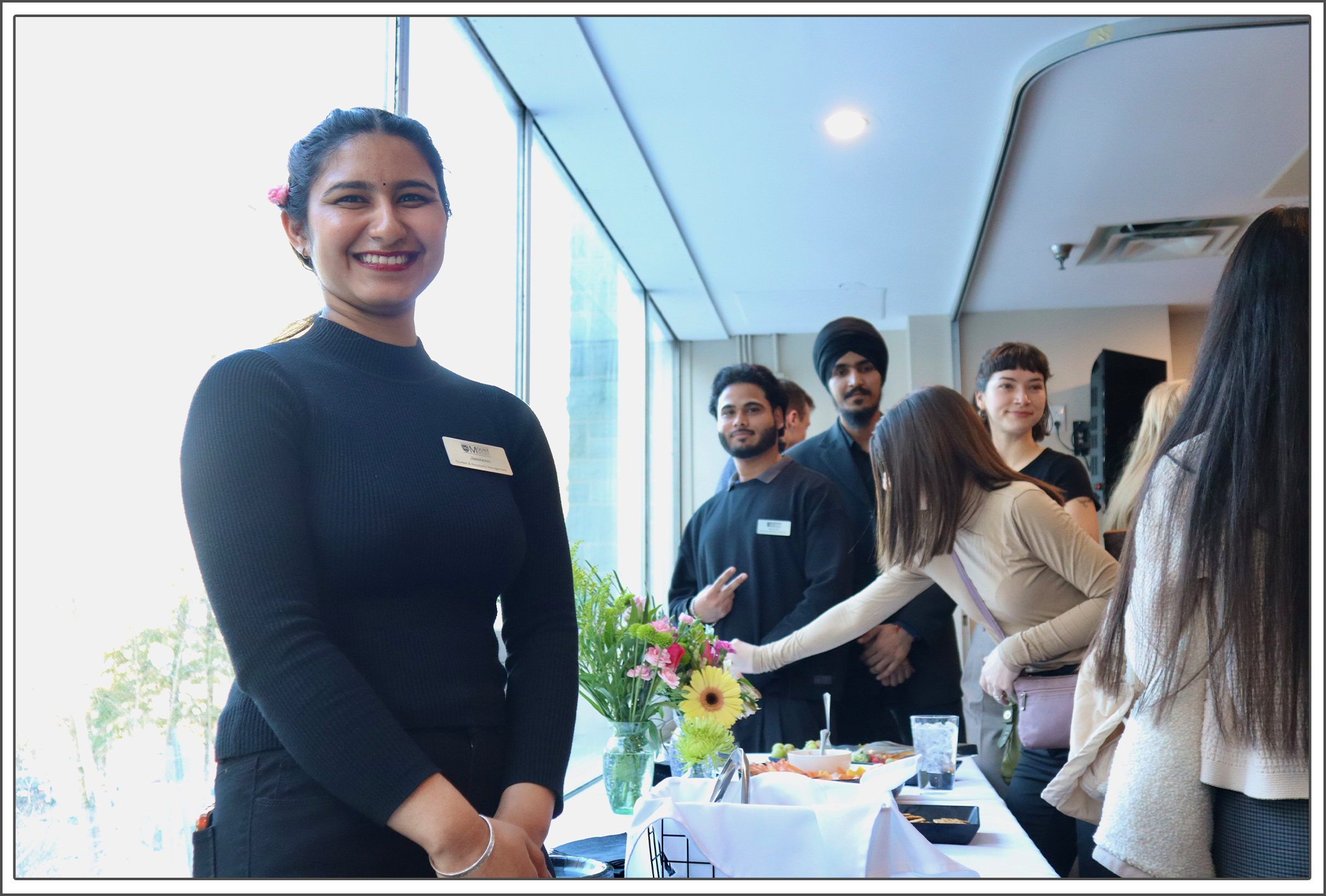 MSVU Tourism and Hospitality student smiling at the camera during the SKAL annual dinner event in 2026.