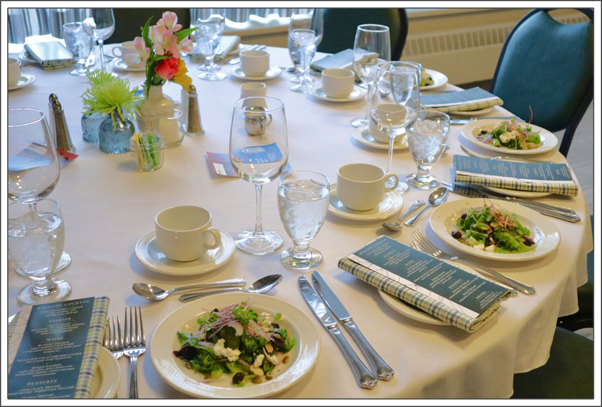 Mount Tourism and Hospitality Management Vincent's restaurant. Table fully set for dining service with first course salad.