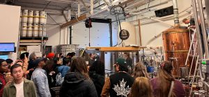 Business and Tourism students in the schoolhouse brewery while on the fall 2022 sustainable business tour