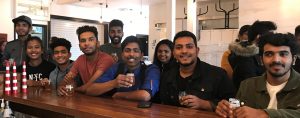 2019 Local entrepreneur and cultural tourism tour. People at a bar in a brewery.