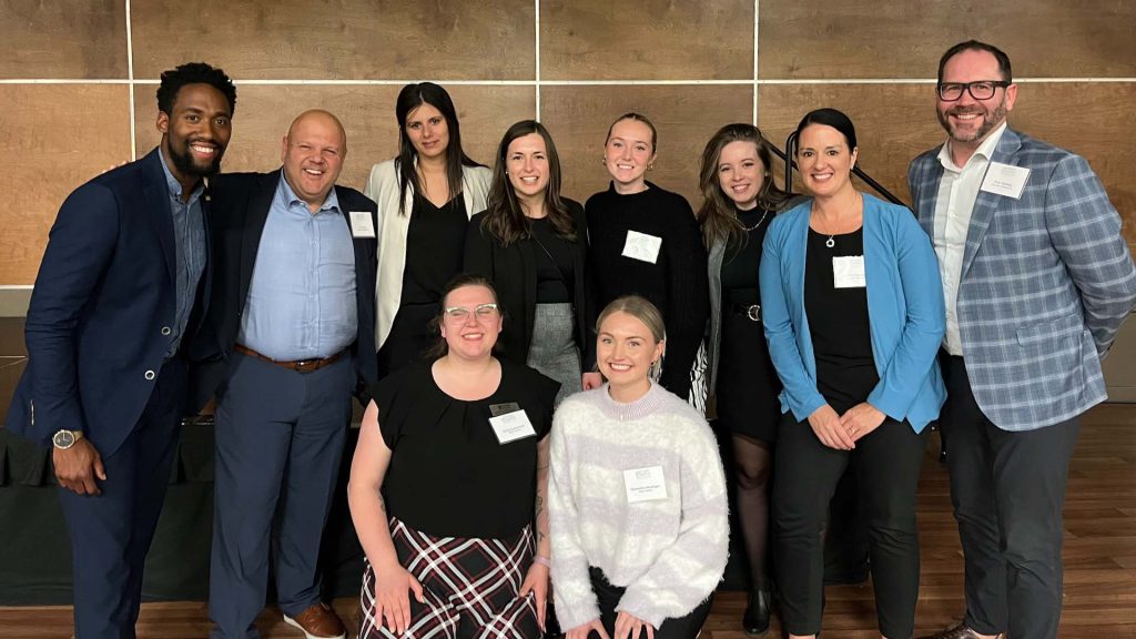 MSVU business and tourism students and industry leaders standing together for a group photo at a learners and leaders conference.