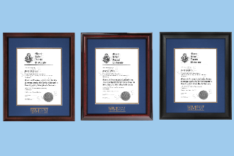 3 MSVU diploma frames with various wood types on a light blue background