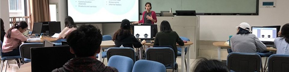 Business Faculty teaching in a classroom