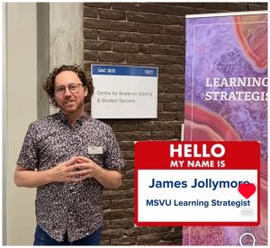 James Jollymore, Learning Strategist, standing in front of the Centre for Academic Advising