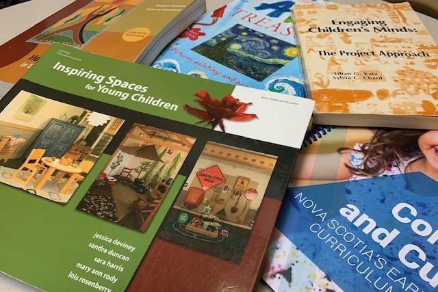 Several Books about Childcare and the Nova Scotia Early Childhood Curriculum document