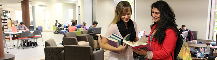 Two girls in library