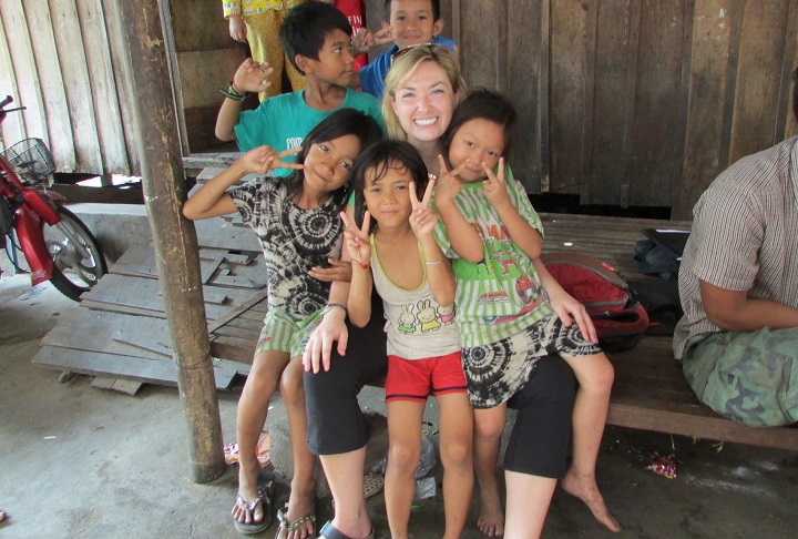 Dr Whitfield with kids in Cambodia