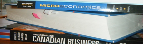 stack of economic books