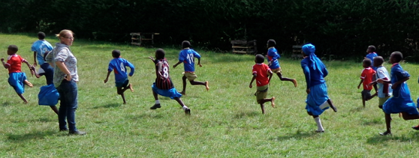 Harriet with students outdoors in Kenya