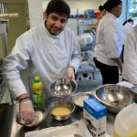 Tourism and Hospitality Management student hard at work preparing food for Vincent's Restaurant. 