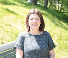 Marisha Caswell sitting outside of Evaristus Hall at Mount Saint Vincent University