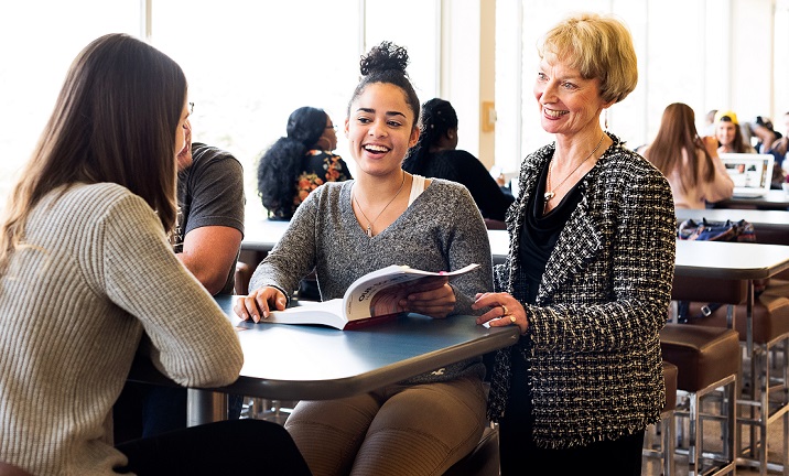 Mary with students