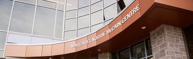 Close up of the entrance of the Margaret Norrie McCain Centre focusing on the entrance arch on the