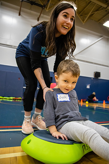 MSVU student and a PACE participant using a stepping stone