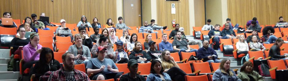 Students sitting in the auditorium