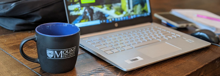 MSVU Coffee Cup and laptop