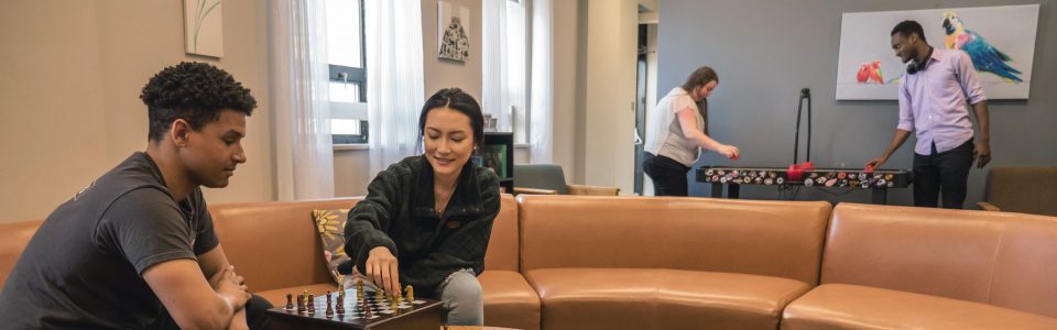 Students in the Assisi Residence Hall student lounge