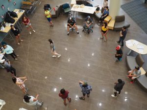 Jaclyn MacNeil co-creating a dream catcher in McCain centre