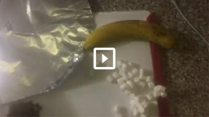 banana, marshmallows, tinfoil on cutting board