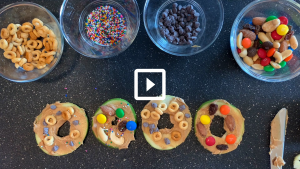 picture of apple slices and bowls of candy toppings