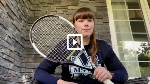 woman holding a tennis racket 