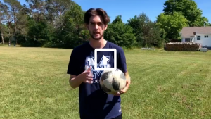 man holding soccer ball