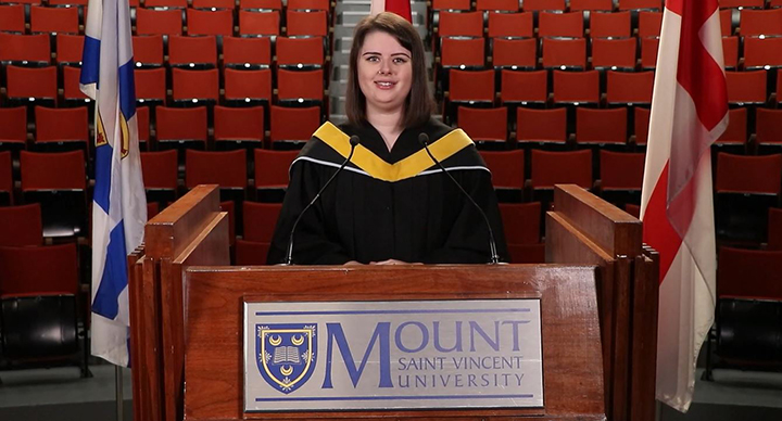 Valedictorian speaking at podium