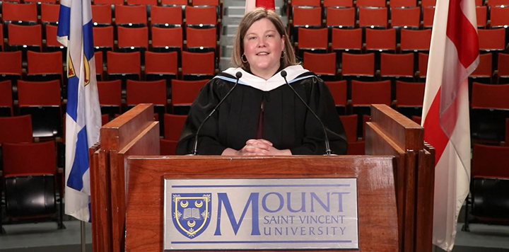 Valedictorian speaking at podium