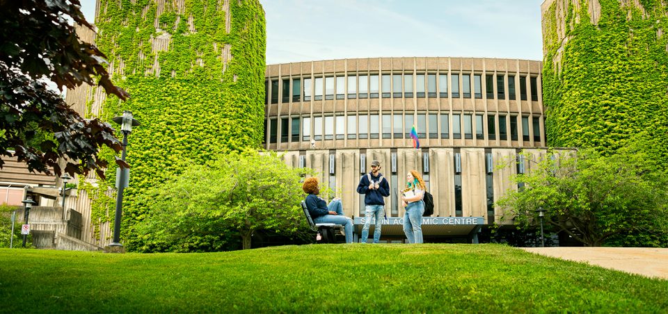 Three students talking outside of Seton