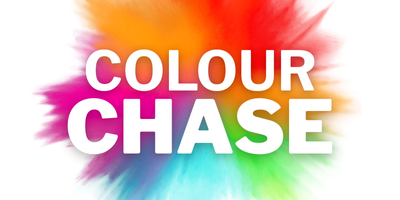 The image shows the words 'COLOUR CHASE' in bold white capital letters, centered on a vibrant background of splattered colors including red, orange, yellow, green, blue, and purple.