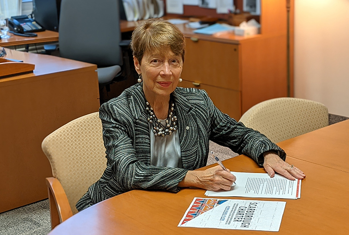 Dr. Lumpkin signing the Scarborough Charter 