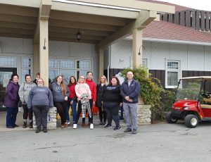 Tourism students outside of a hotel