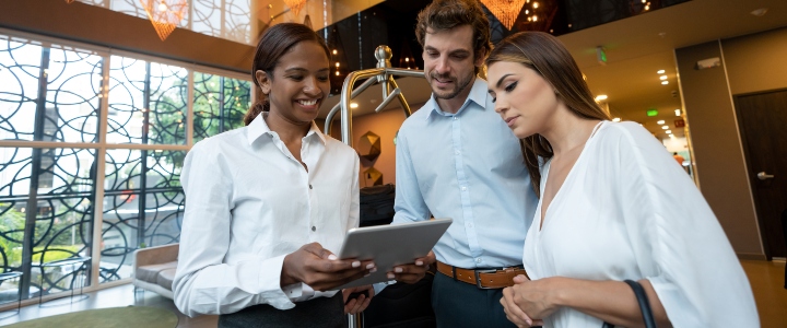 hotel manager helping guests