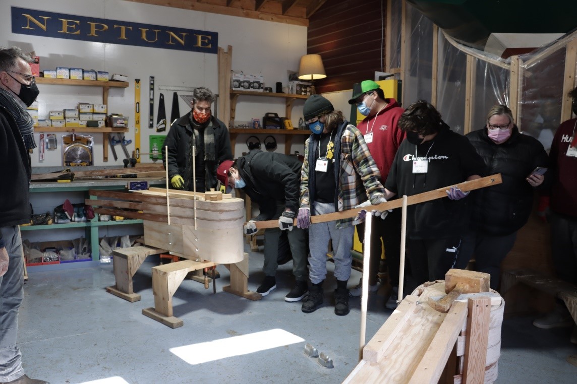 Youth from Sipekne’katik First Nation building Toboggans, led by Eamonn Doorly (far left), Shipwright/Assistant Curator of Small Craft, Maritime Museum of the Atlantic