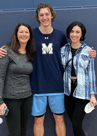 Brooke Van Tassel (right) with her partner, MSVU men's basketball team member Dawson Berze-Butts (centre) and his mother, Mary-Alice Berze-Butts (left)