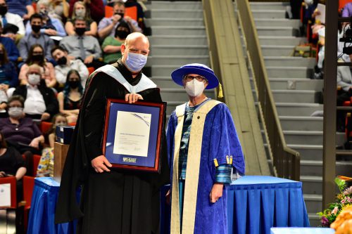 Dr Zachary Zimmer Receiving a 2022 Research award at Spring Convocation