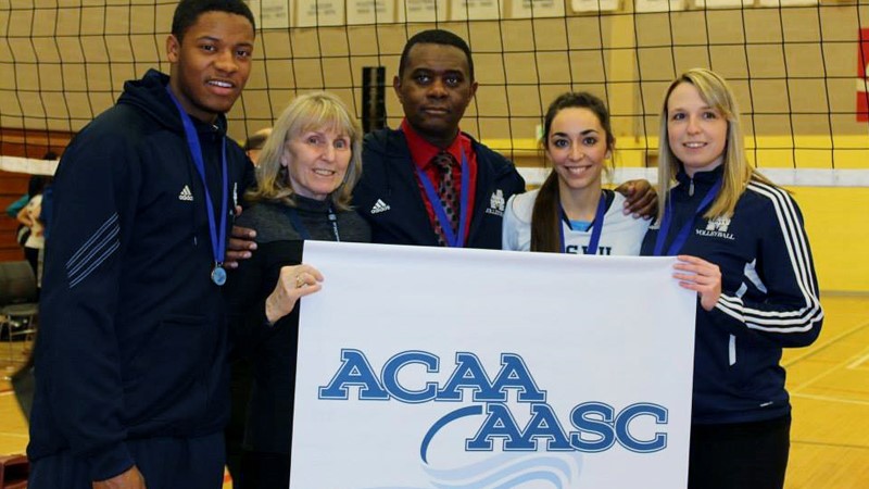 MSVU Athletics Director June Lumsden is pictured with athletes and colleagues: Tyler Simmons, June Lumsden, Derrick Brooks, Haley MacDonald, and Jamie Brown