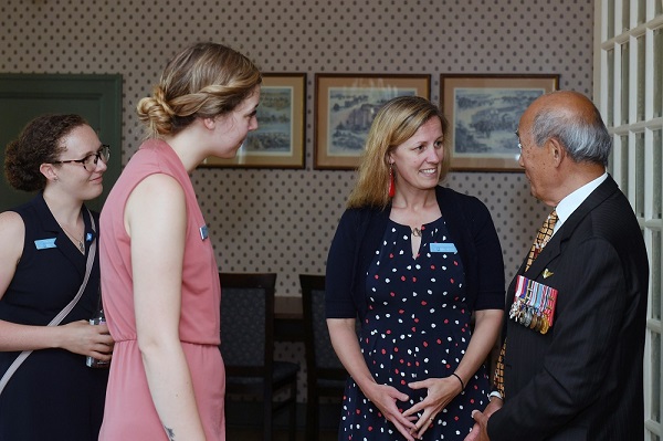 Catherine Baillie Abidi speaking to a distinguished veteran 