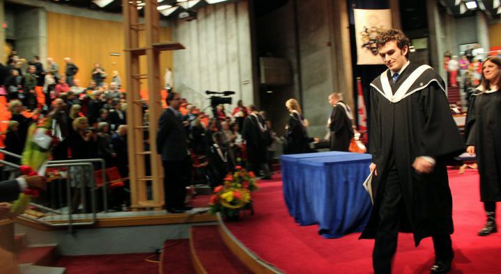 Sean Joudry crossing the stage at Convocation