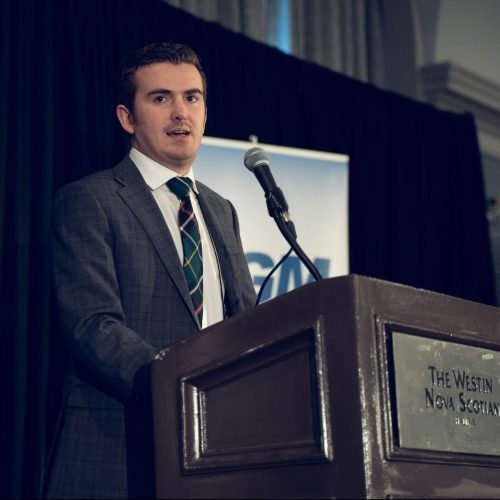 Sean Joudry speaking at a podium