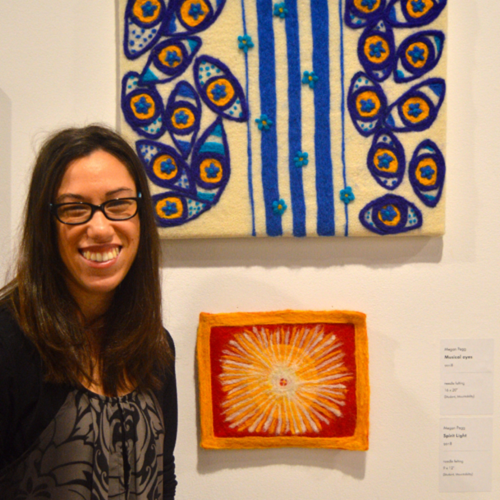 Megan alongside her artwork at the MSVU Art Gallery in 2018.