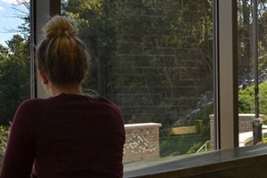 Counselling Services what to do if you're concerned about a student. Picture of a student looking out a window.