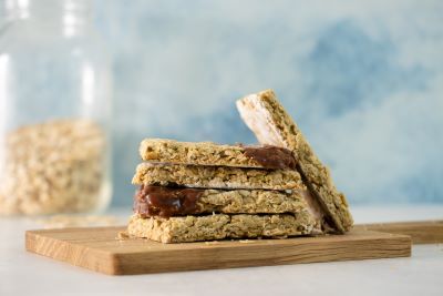 Five Vegan Gluten Free Nova Scotian Oatcakes on a wooden serving board