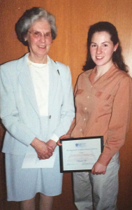 Dr. Alleyne Murphy, the first full-time lay professor at MSVU standing beside a Home Economics/Human Ecology student with their diploma