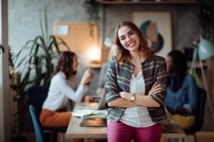 Stock photo of female Caucasian smiling and crossing her arms