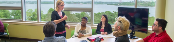 a Professor speaking to their students in a McCain classroom